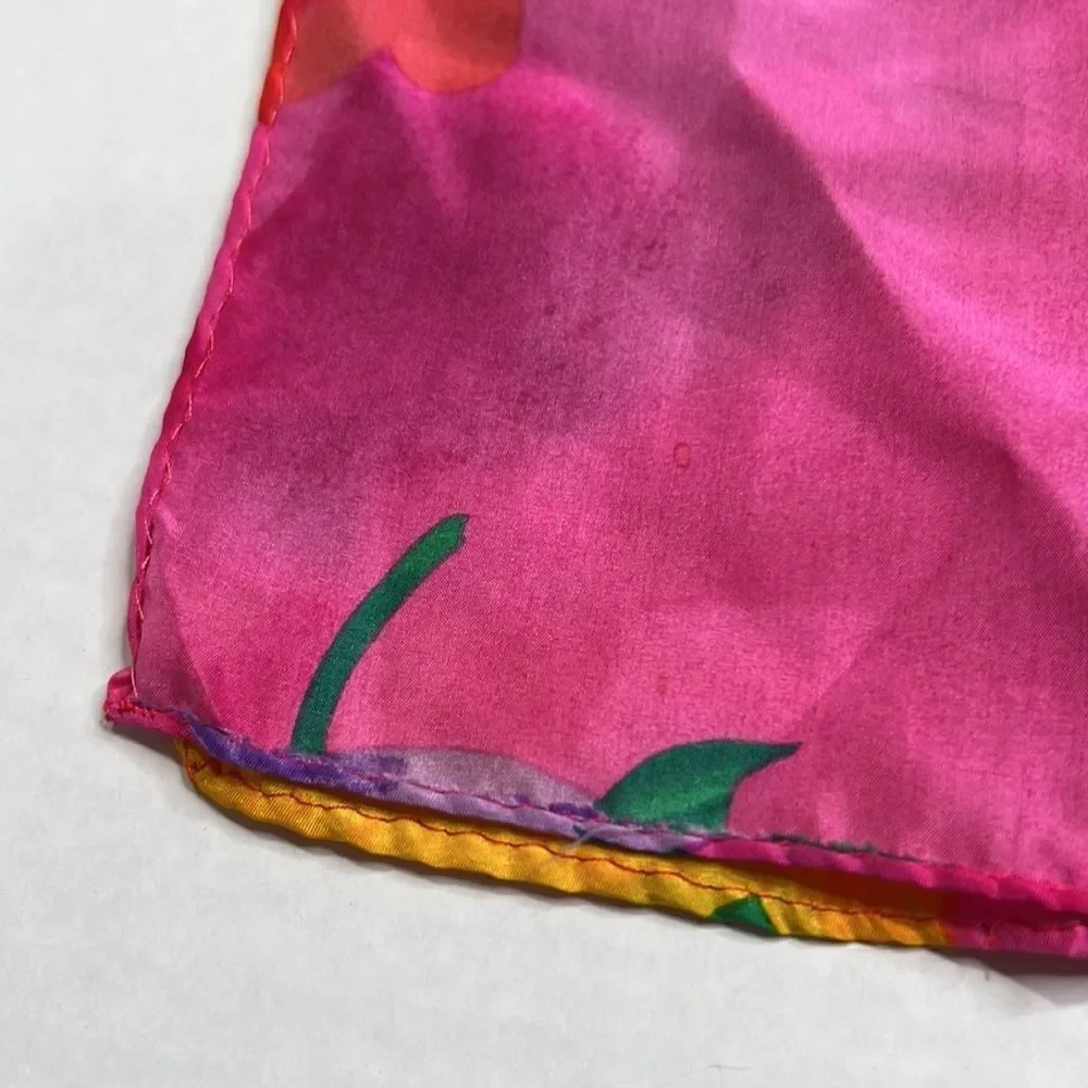 Vibrant floral silk scarf with gold purple pink and red flowers.